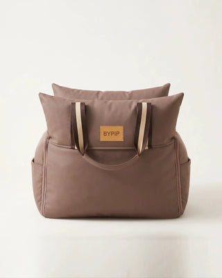 Mellow Car Seat in taupe, front view with BYPIP label and striped handles