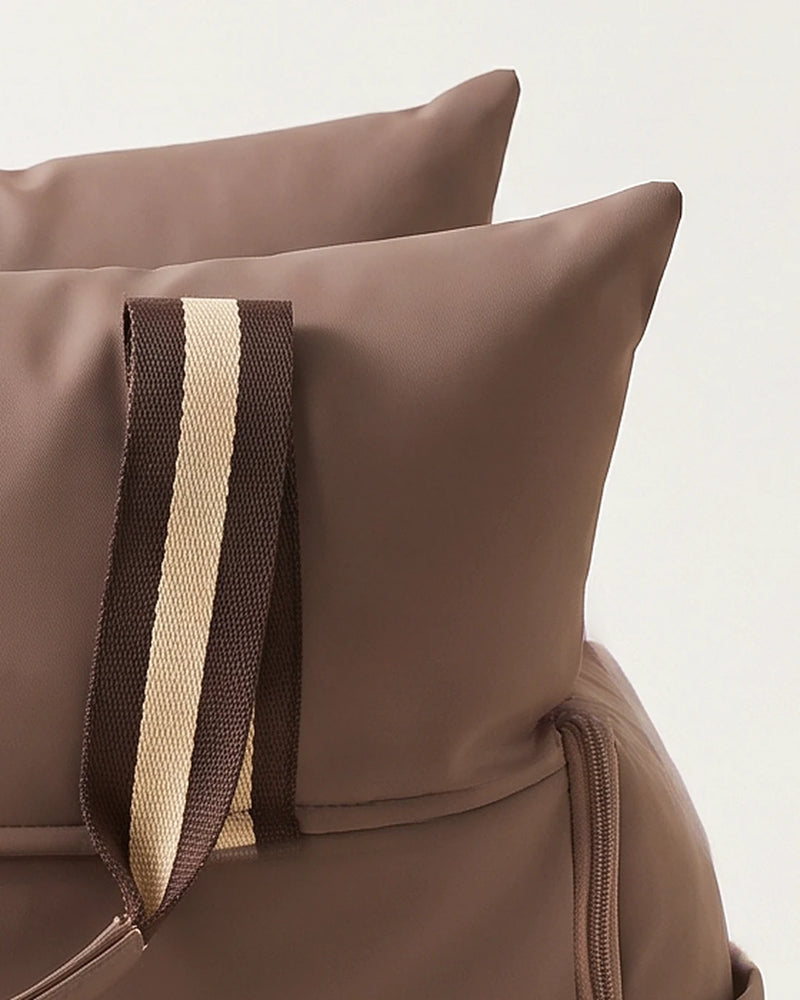 Close-up of the striped carry handle on the Pip Dog Car Seat