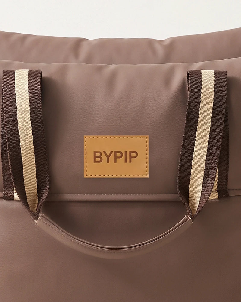 Close-up of the BYPIP label and handles on the Pip Dog Car Seat